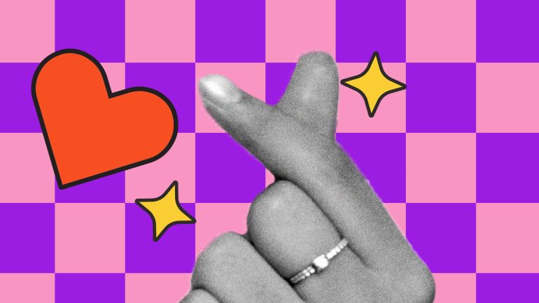Hand making finger heart sign for K-Plus