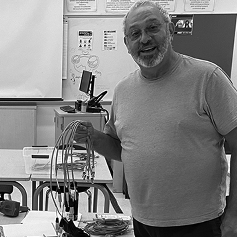 Buzz smiling at the camera in class